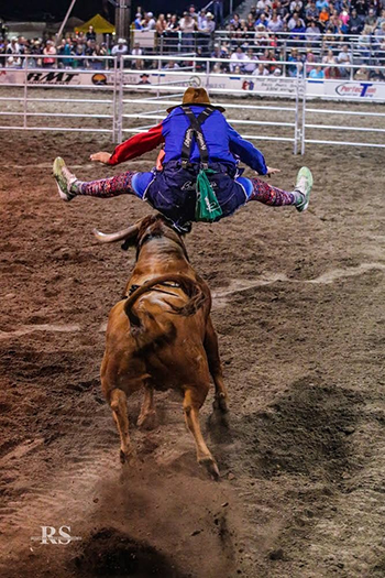 Justin Josey jumps over Miguel Costa's Sid Vicious to start his winning bout at Bullfighters Only-Lewiston this past weekend. (ROSEANNA SALES PHOTO)