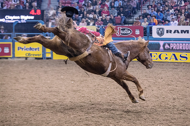 Clayton Biglow rides Beutler & Son Rodeo's South Suds for 86.5 points to finish second during Thursday's eighth round of the Wrangler National Finals Rodeo. (TODD BREWER PHOTO)