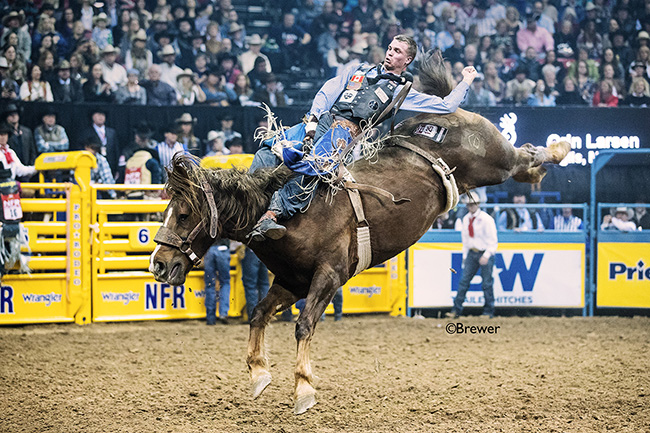 Orin Larsen rides Four Star Rodeo's Big Star for 86 points to finish third in Sunday's fourth go-round of the Wrangler National Finals Rodeo. (TODD BREWER PHOTO)